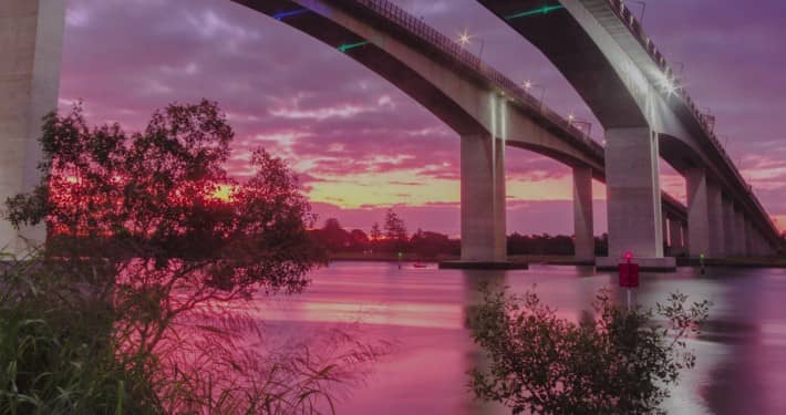 Image of a Bridge over a River at Sunset