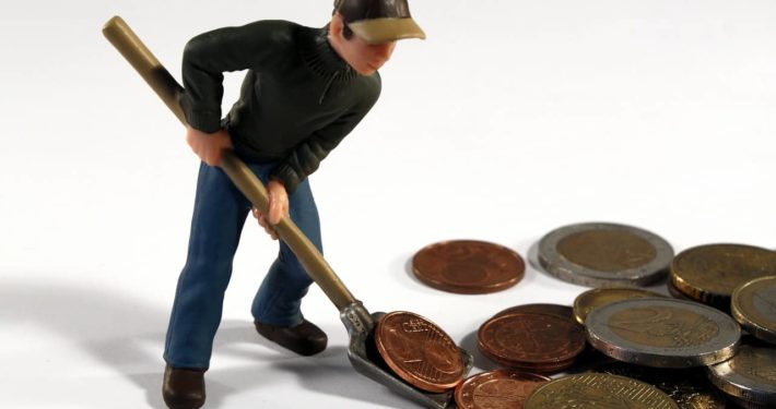 image of a figure scooping money, traditional business loans