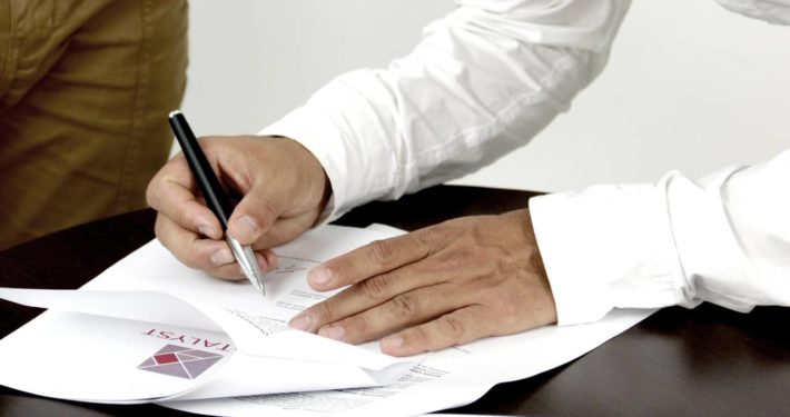 image of someone signing Asset Finance contact, Free up Funds