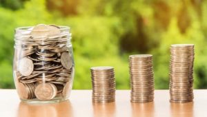 image of coins in a jar and in piles